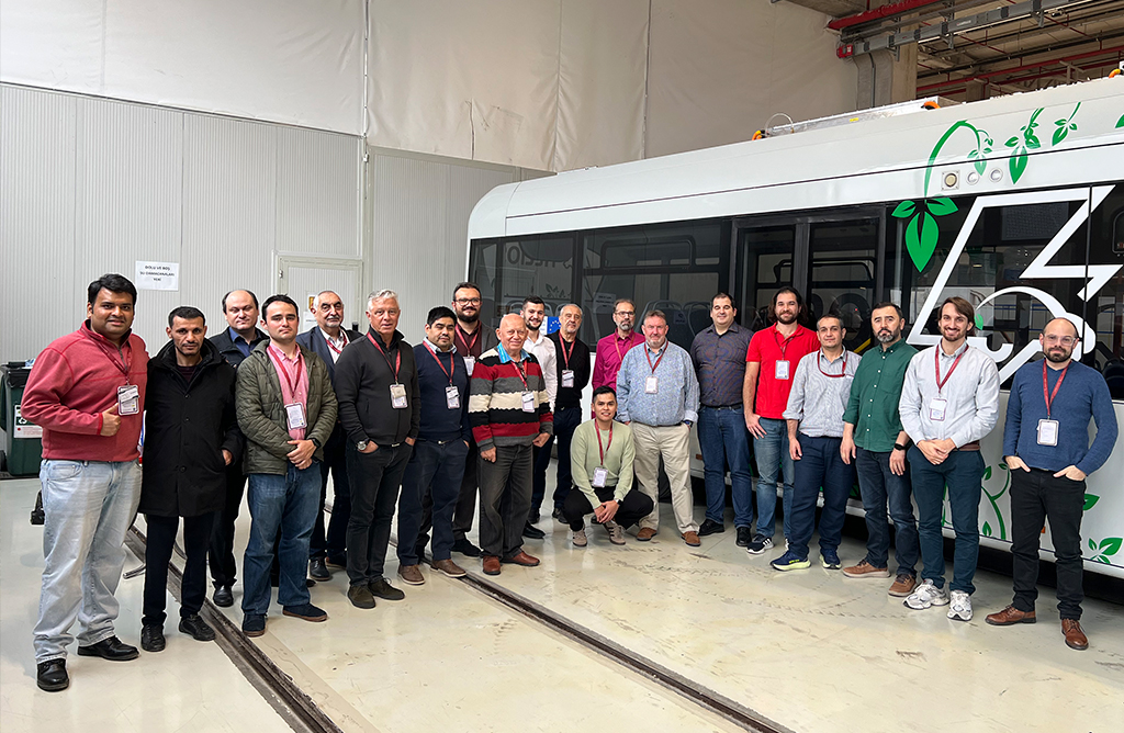 A group of people in front of the eBus developed within the project