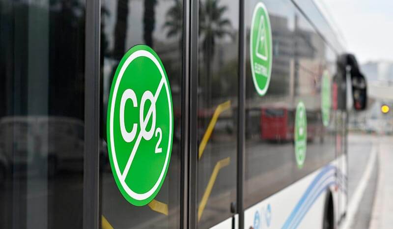 City electric bus. Selective focus on sign: without Carbon dioxide CO2