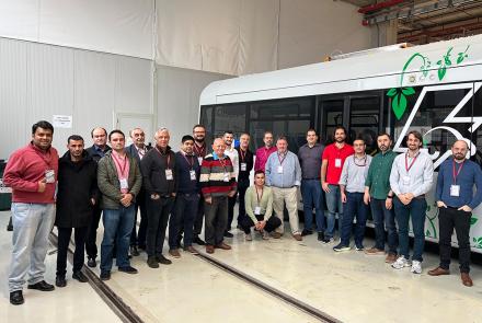 A group of people in front of the eBus developed within the project